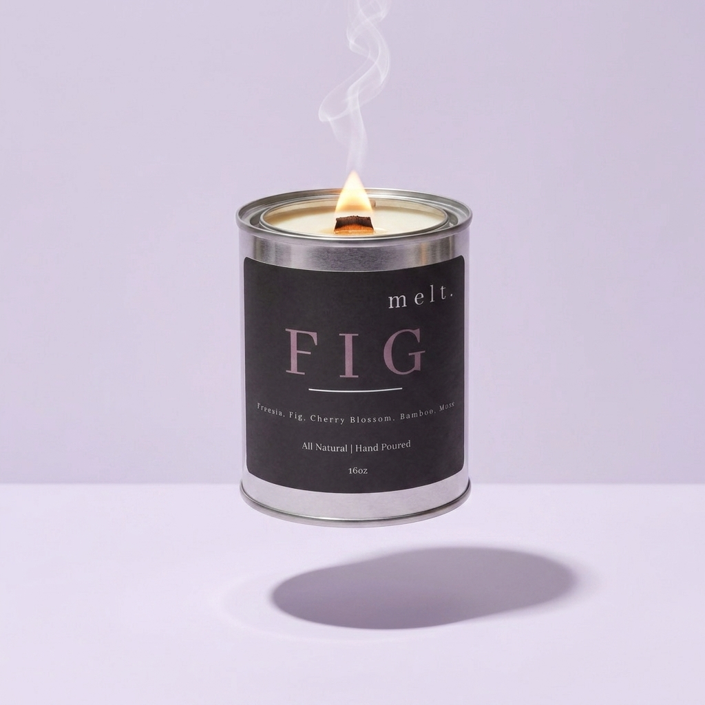 melt. fig candle floating with lit wooden wick and a wisp of smoke on a pale lavender background