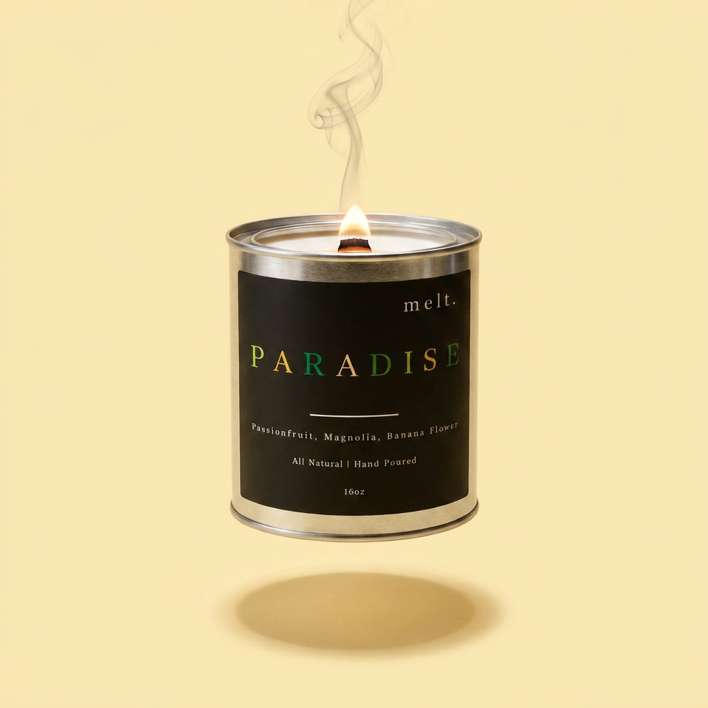 melt. paradise candle floating with lit wooden wick and a wisp of smoke on a pale butter yellow background